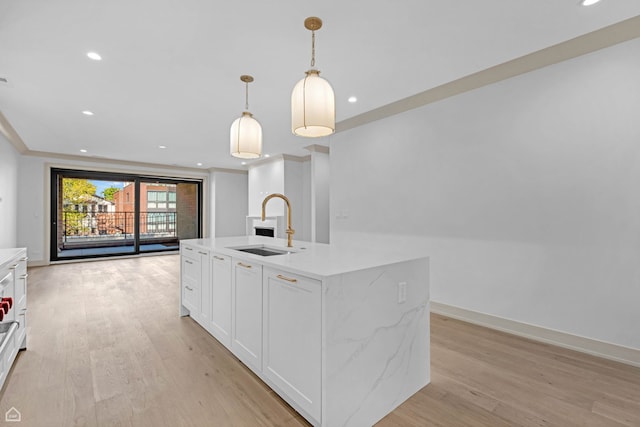 1646 N Orchard St Unit 3S, Chicago, IL 60614 - kitchen featuring a sink, light wood-style floors, recessed lighting, white cabinets, and a kitchen island with sink
