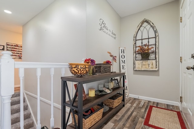 interior space with wood finished floors, recessed lighting, stairs, and baseboards