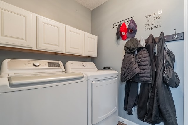 laundry area with washer and dryer and cabinet space