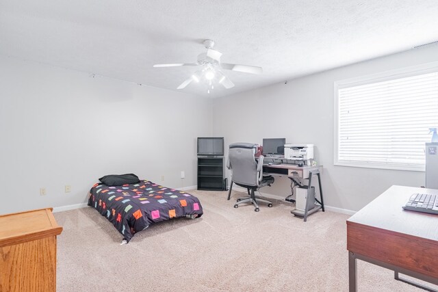 bedroom with a ceiling fan, a closet, baseboards, carpet flooring, and baseboard heating