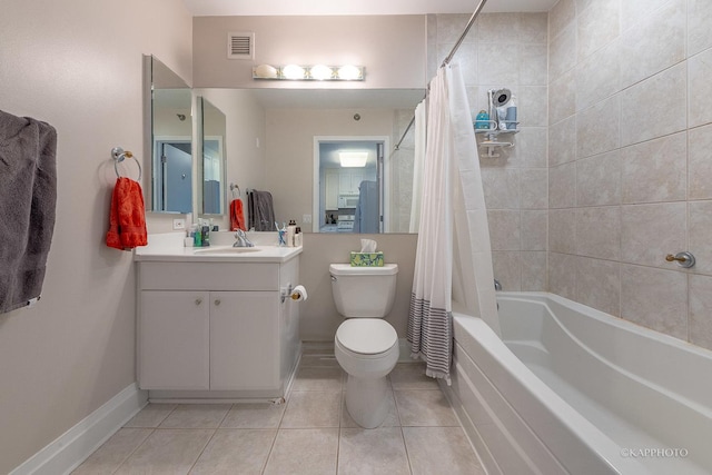 bathroom featuring visible vents, toilet, shower / tub combo with curtain, vanity, and tile patterned floors