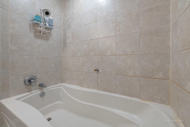 full bathroom featuring a bath and walk in shower