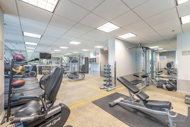 exercise room with a paneled ceiling