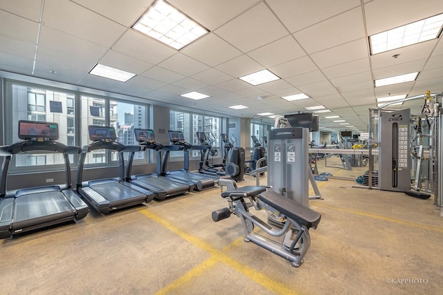 exercise room featuring a drop ceiling