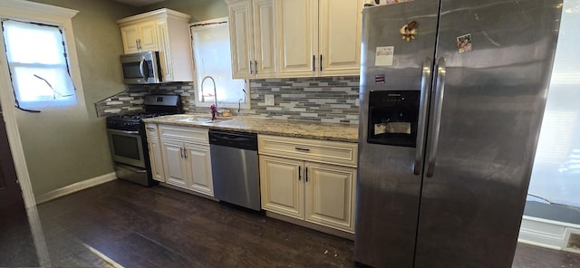 8605 S Dorchester Ave, Chicago, IL 60619 - kitchen with dark wood-type flooring, light stone counters, stainless steel appliances, baseboards, and backsplash