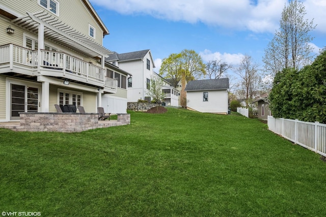 view of yard featuring a patio, fence, and a deck