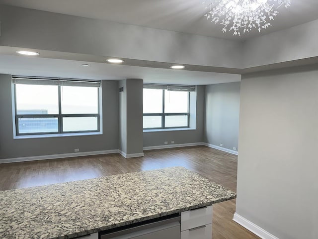 474 N Lake Shore Dr Unit 6102, Chicago, IL 60611 - interior space featuring a notable chandelier, baseboards, light stone counters, recessed lighting, and wood finished floors