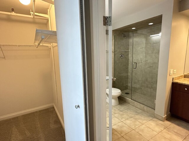 474 N Lake Shore Dr Unit 6102, Chicago, IL 60611 - bathroom with a shower stall, vanity, toilet, a walk in closet, and tile patterned floors