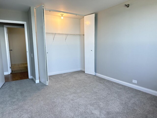 474 N Lake Shore Dr Unit 6102, Chicago, IL 60611 - unfurnished bedroom with a closet, baseboards, and carpet