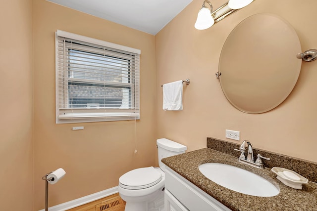 6650 Powell St, Downers Grove, IL 60516 - bathroom featuring visible vents, toilet, vanity, and baseboards