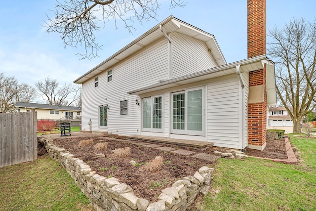 6650 Powell St, Downers Grove, IL 60516 - rear view of house with fence, a patio, and a chimney