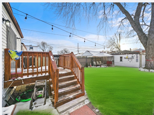 view of yard featuring fence and a deck