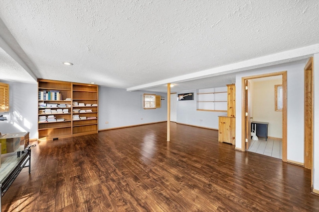 609 Chippewa Ln, Darien, IL 60561 - basement featuring a textured ceiling, wood finished floors, and baseboards