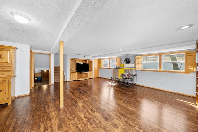 609 Chippewa Ln, Darien, IL 60561 - unfurnished living room with a wealth of natural light, baseboards, wood finished floors, and a textured ceiling