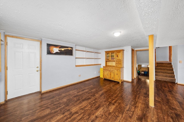 609 Chippewa Ln, Darien, IL 60561 - finished below grade area with baseboards, a textured ceiling, stairs, and dark wood finished floors