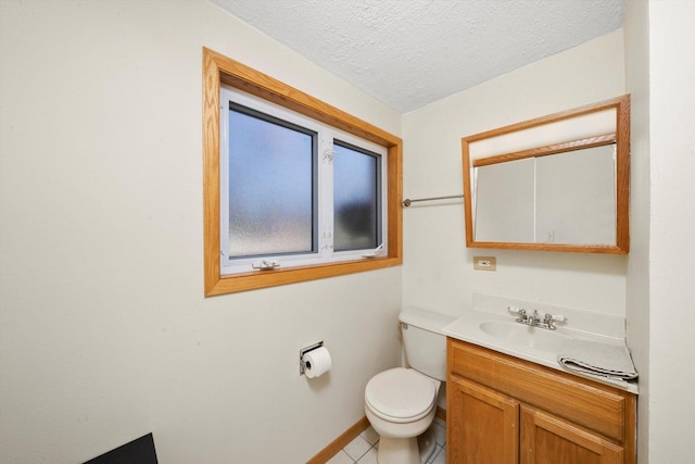609 Chippewa Ln, Darien, IL 60561 - bathroom with vanity, baseboards, tile patterned floors, a textured ceiling, and toilet
