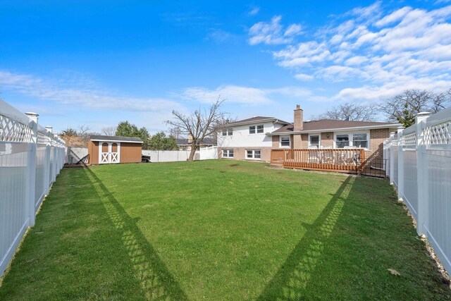 609 Chippewa Ln, Darien, IL 60561 - view of yard featuring a storage shed, an outbuilding, a fenced backyard, and a deck