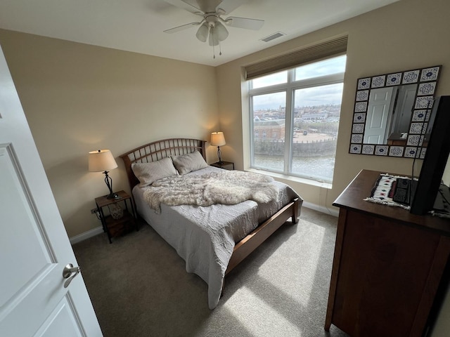 140 S River St Unit 409, Aurora, IL 60506 - bedroom with visible vents, baseboards, ceiling fan, and light colored carpet