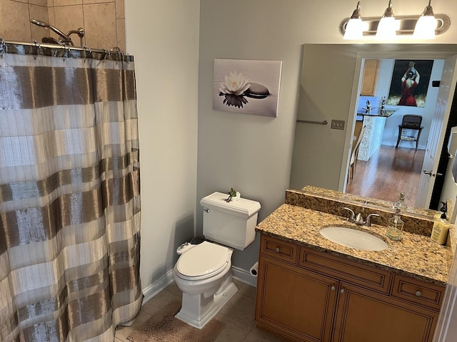 140 S River St Unit 409, Aurora, IL 60506 - bathroom featuring vanity, baseboards, tile patterned flooring, a shower with curtain, and toilet