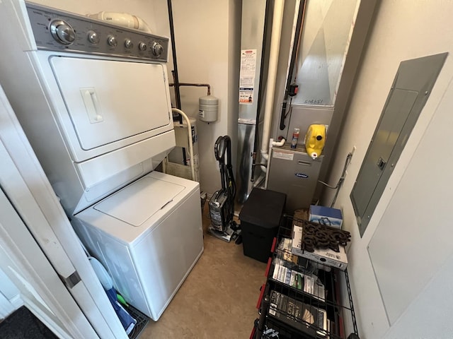 140 S River St Unit 409, Aurora, IL 60506 - laundry area featuring carpet floors, stacked washing maching and dryer, and laundry area