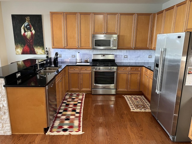 140 S River St Unit 409, Aurora, IL 60506 - kitchen with a sink, dark countertops, dark wood-type flooring, and stainless steel appliances