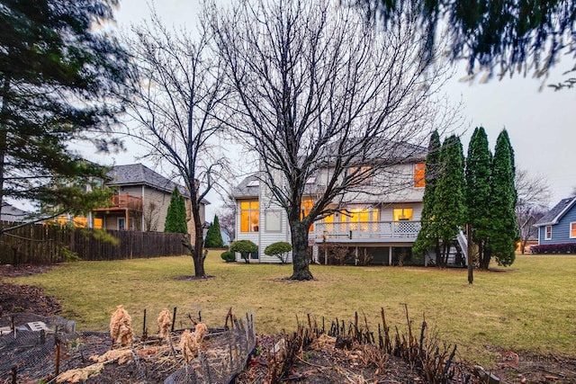 view of yard featuring fence, stairway, and a wooden deck