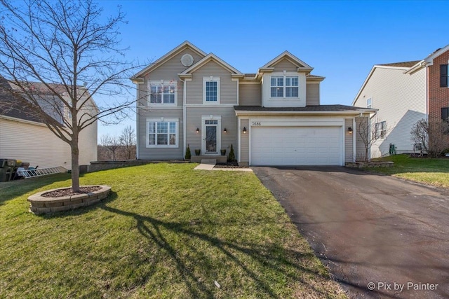 traditional-style home featuring driveway, a garage, and a front lawn