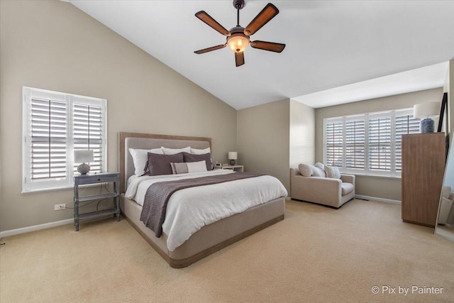 carpeted bedroom with ceiling fan, baseboards, and lofted ceiling