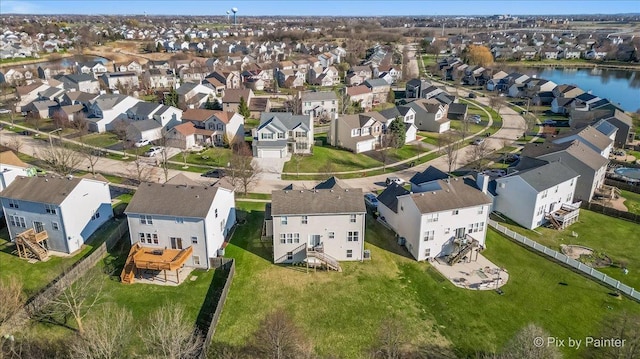 birds eye view of property featuring a water view and a residential view