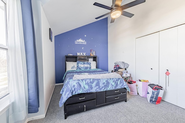 carpeted bedroom featuring ceiling fan and lofted ceiling