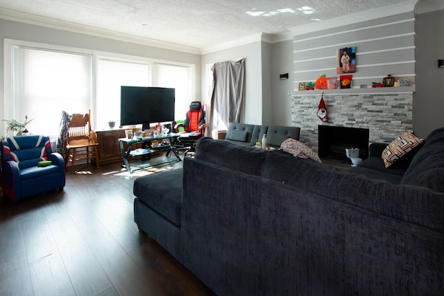 living room with a fireplace, dark wood-style flooring, a textured ceiling, and crown molding