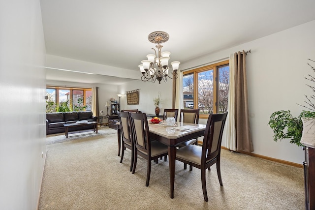 16439 Morgan Ln, Orland Hills, IL 60487 - dining space featuring light carpet, baseboards, and a notable chandelier