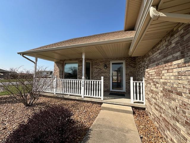 110 E Spring Rd, Coal City, IL 60416 - property entrance featuring brick siding and covered porch