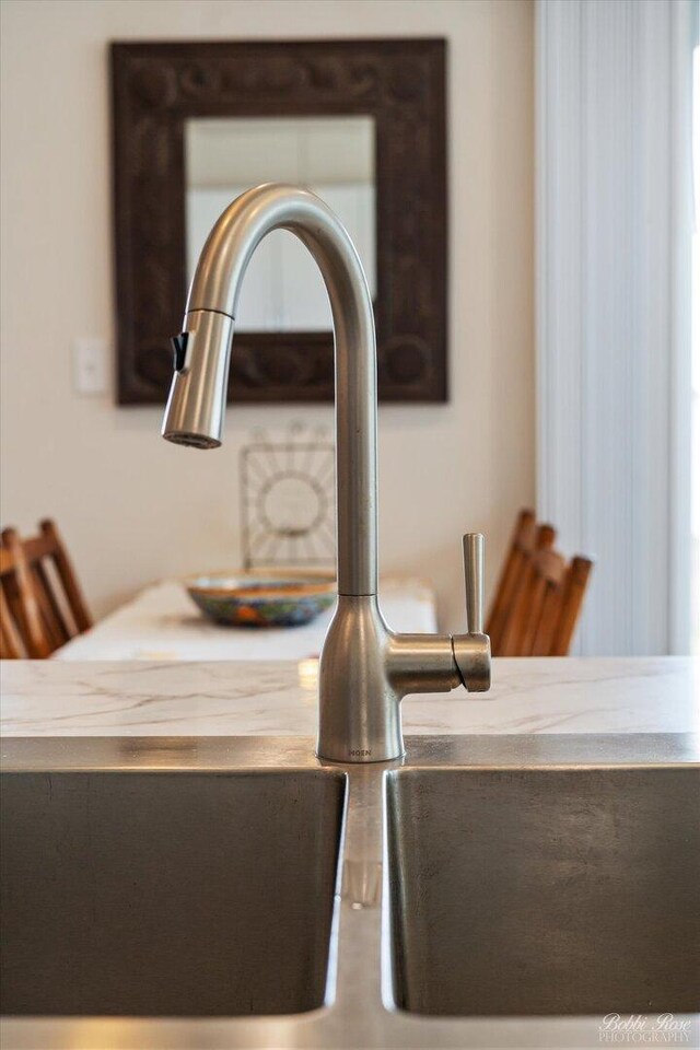 details featuring a sink and light countertops