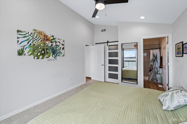 carpeted bedroom with a ceiling fan, baseboards, and lofted ceiling