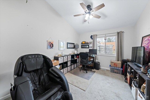 office space featuring baseboards, a ceiling fan, carpet flooring, and lofted ceiling