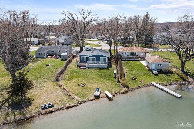 bird's eye view with a water view and a residential view