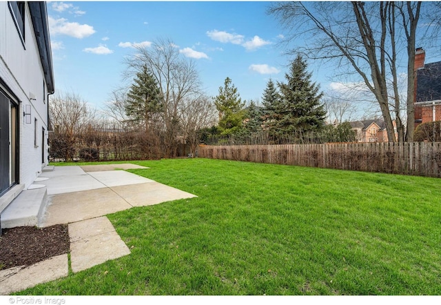 view of yard with a patio and a fenced backyard