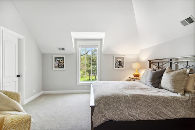 carpeted bedroom with visible vents, baseboards, and vaulted ceiling