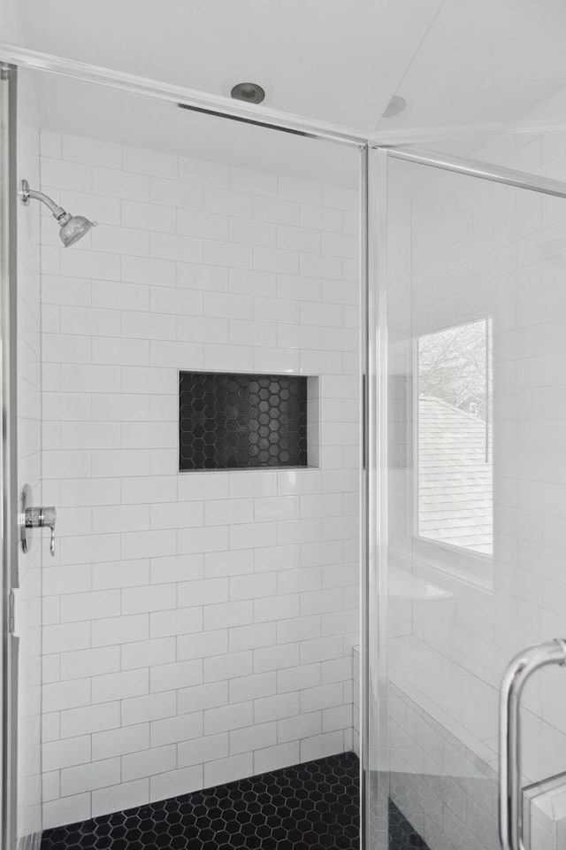 bathroom with a shower stall
