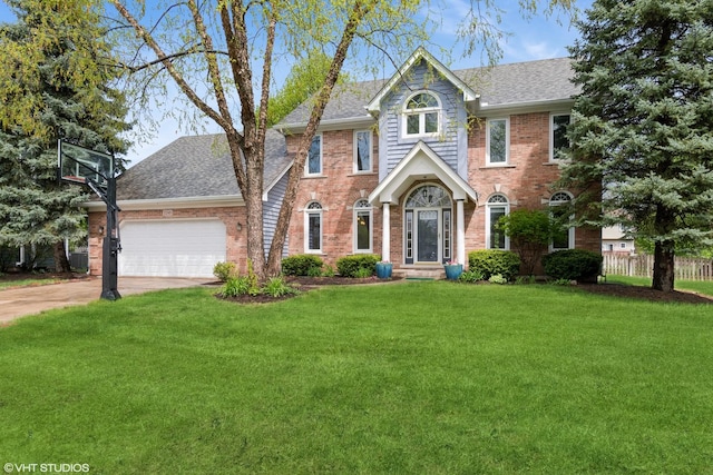 view of front facade featuring a shingled roof, driveway, a front lawn, and brick siding