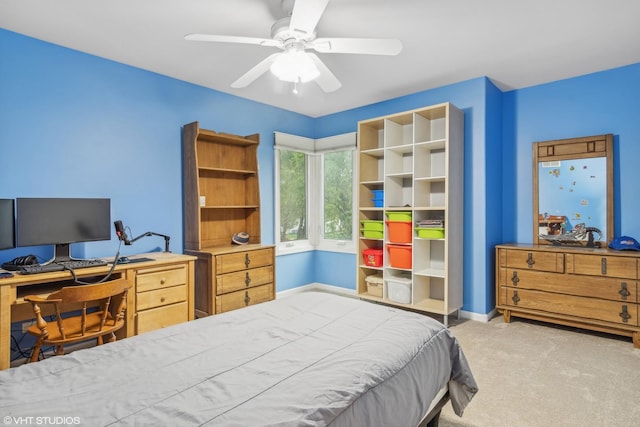 carpeted bedroom with baseboards and ceiling fan