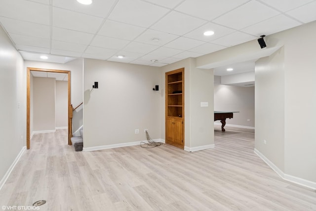 finished basement featuring baseboards, stairway, light wood-type flooring, recessed lighting, and billiards
