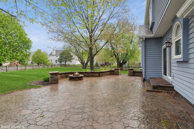 view of patio / terrace featuring fence and an outdoor fire pit