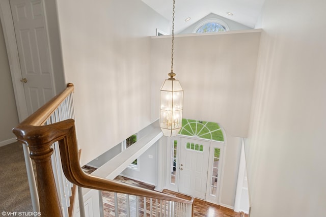 foyer with a chandelier and high vaulted ceiling