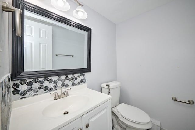212A Collen Dr Unit 104, Lombard, IL 60148 - bathroom featuring tasteful backsplash, vanity, and toilet