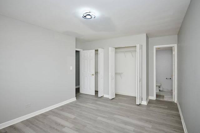 212A Collen Dr Unit 104, Lombard, IL 60148 - unfurnished bedroom featuring two closets, baseboards, and light wood-type flooring