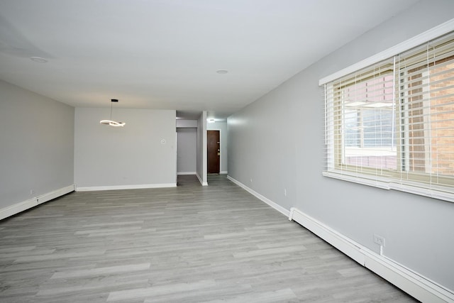 212A Collen Dr Unit 104, Lombard, IL 60148 - unfurnished room featuring wood finished floors, a baseboard heating unit, and baseboards