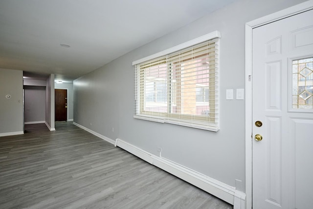 212A Collen Dr Unit 104, Lombard, IL 60148 - foyer entrance featuring a baseboard radiator, baseboards, and wood finished floors