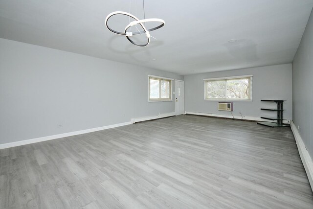 212A Collen Dr Unit 104, Lombard, IL 60148 - interior space featuring a wall mounted AC, a baseboard heating unit, and wood finished floors